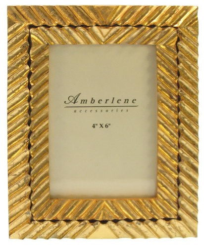 Elegant gold photoframe showcasing cherished memories, perfect for enhancing any decor with timeless charm.
