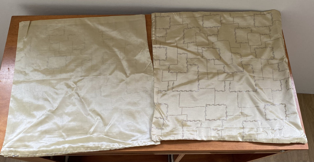 Elegant cream cushion covers with silver cube design, perfect for enhancing home decor. Set of 4 at clearance price.
