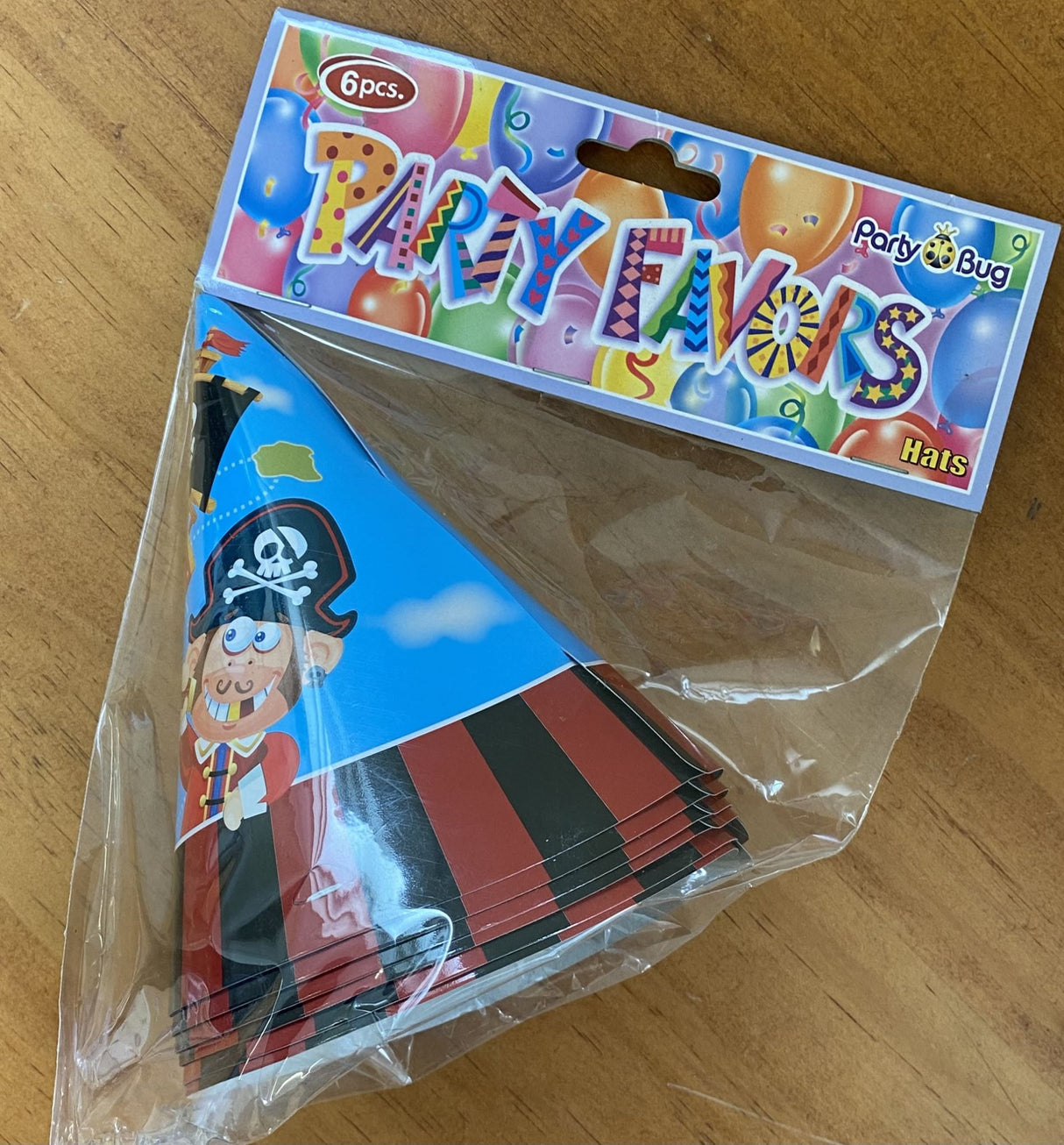Vibrant pirate party hats for kids, featuring skull and crossbones, perfect for adventurous birthday celebrations.
