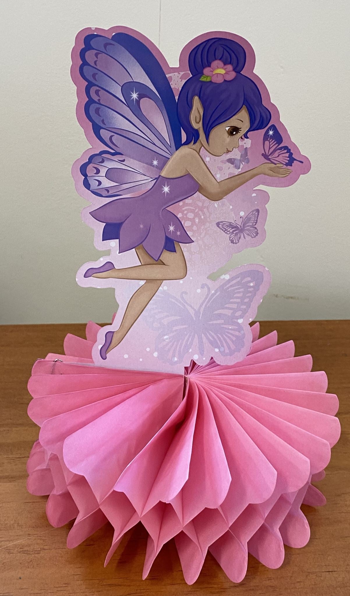 Whimsical fairy princess honeycomb centrepiece in pastel colors for magical parties and celebrations.