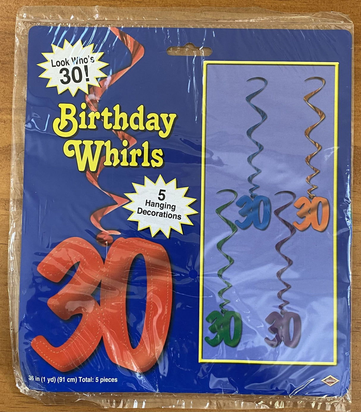 Colorful swirl decorations for a stylish 30th birthday celebration, perfect for indoor and outdoor party setups.