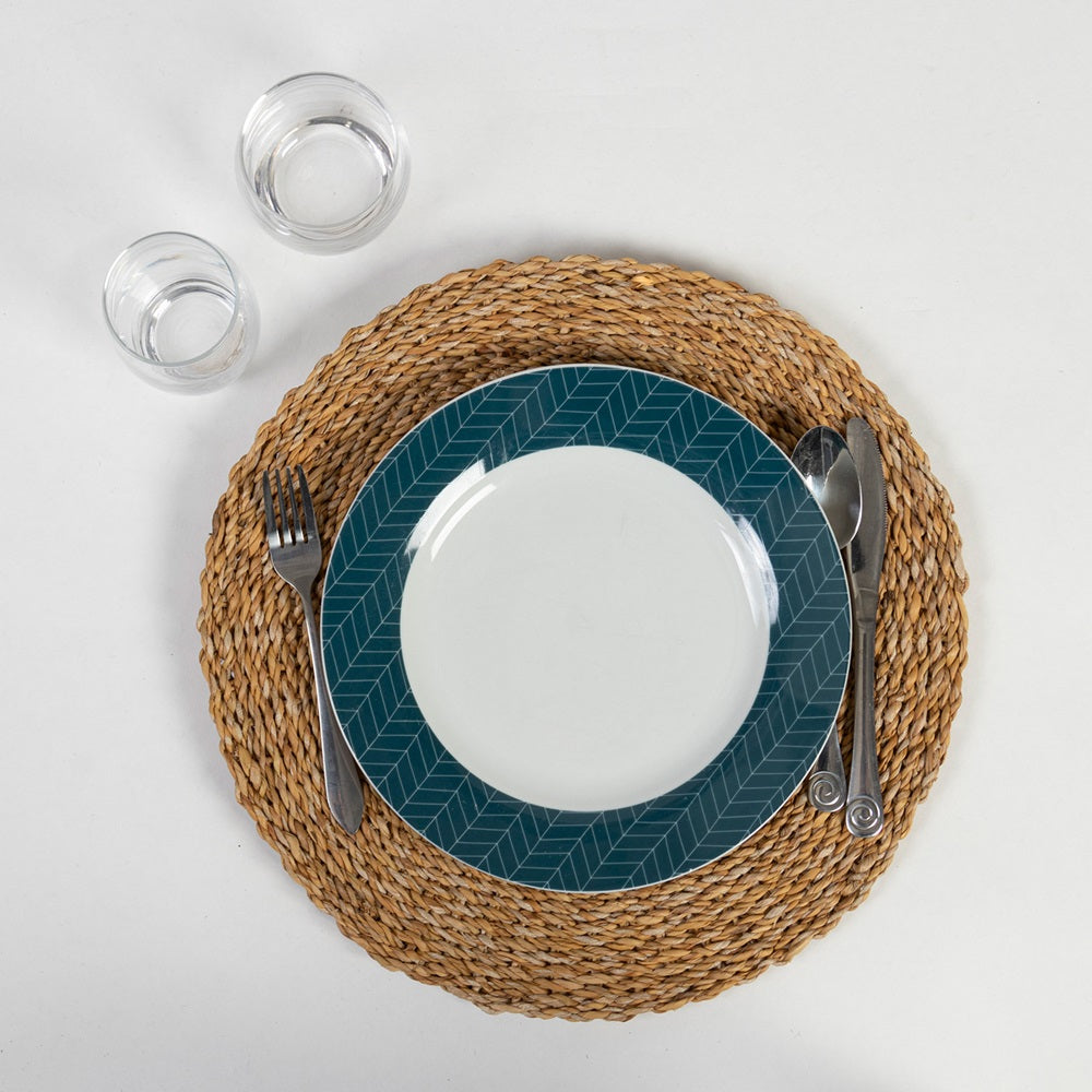 Handmade round seagrass placemat, 400mm diameter, adding coastal charm and durable protection for dining tables.