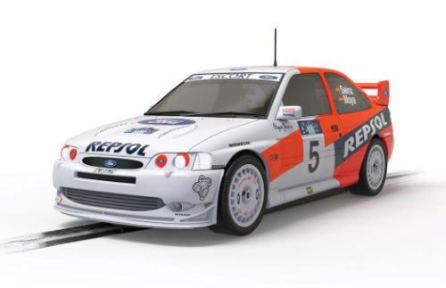 Authentic Scalextric Ford Escort Cosworth WRC '97 model, showcasing Carlos Sainz's iconic rally car with four-wheel drive.