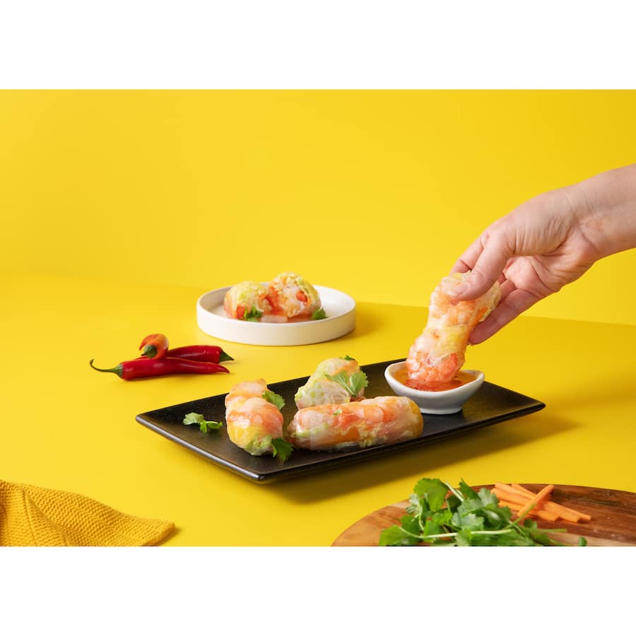 Golden Sun Chilli Sauce offers authentic Thai flavor with 50% less sugar, ideal for dipping and versatile cooking.