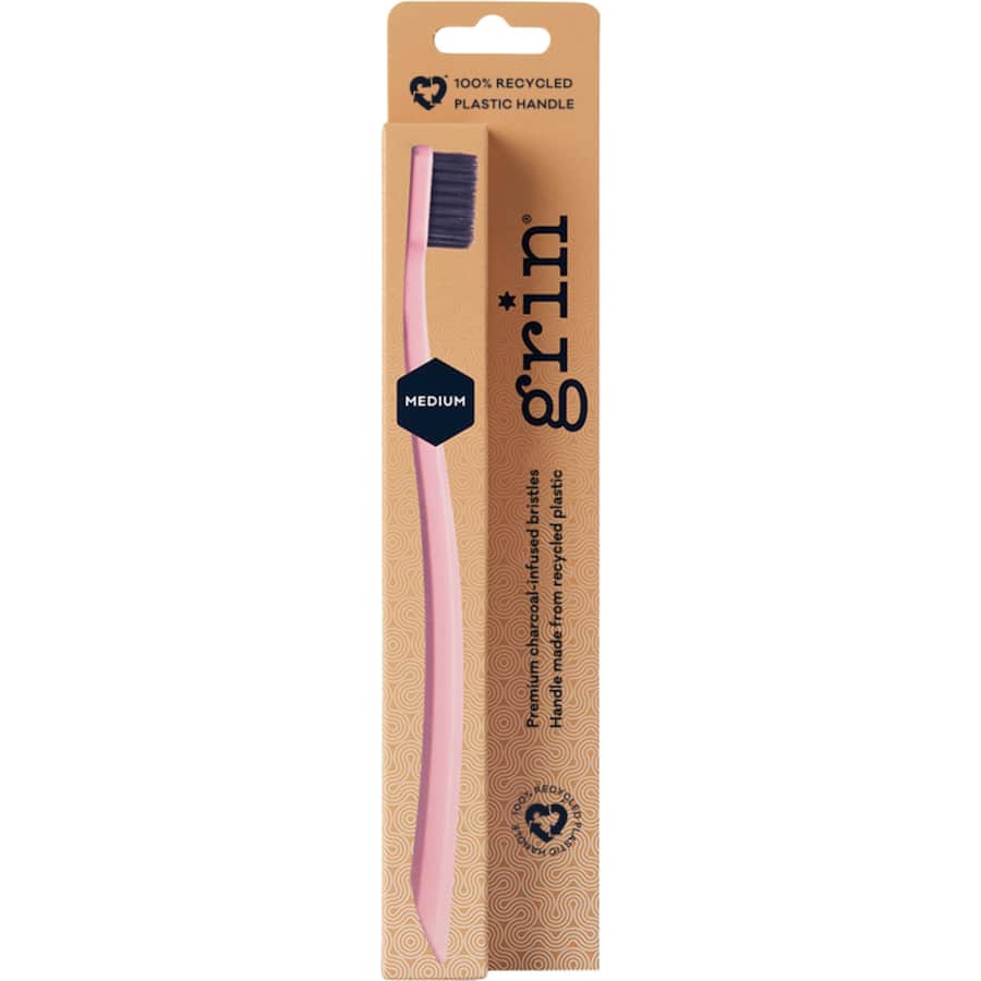 Eco-friendly Grin Toothbrush Medium in Rose or Charcoal, featuring medium bristles and micro slim tips for deep cleaning.