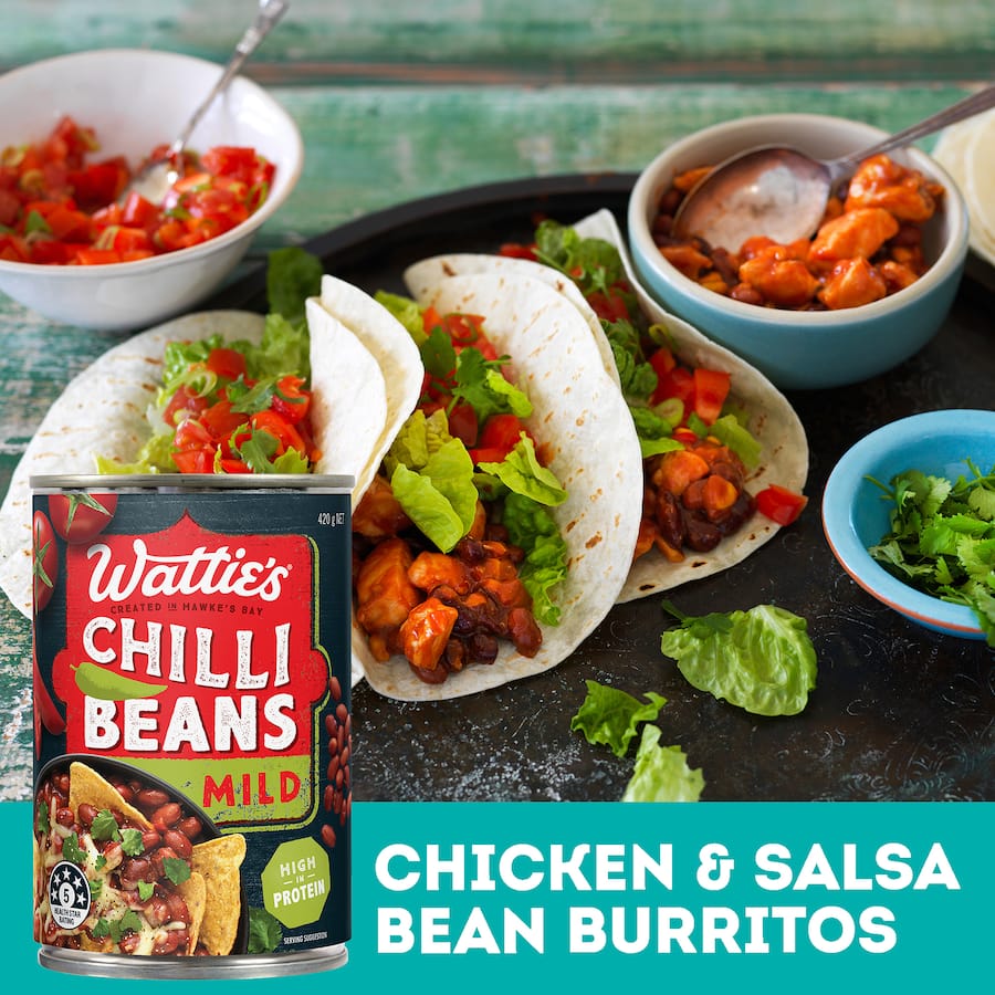 A can of Wattie's Chilli Beans Mild, perfect for tacos, burritos, nachos, and dips, made with no preservatives or additives.