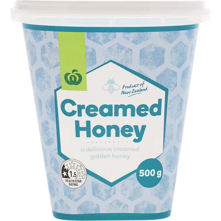 Woolworths Creamed Honey in a jar, showcasing its smooth texture and rich golden color, perfect for sweetening dishes.