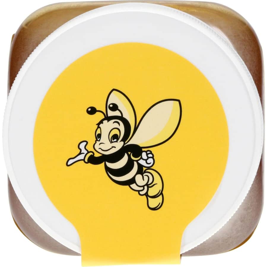 Golden liquid Airborne Clover Honey, offering natural sweetness for beverages and baking.