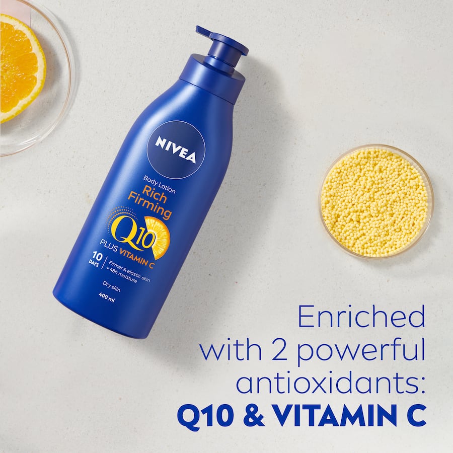 Nivea Body Lotion Rich Firming Q10 in a pump bottle, enhances skin elasticity and hydration for dry skin, enriched with Q10 and Vitamin C.