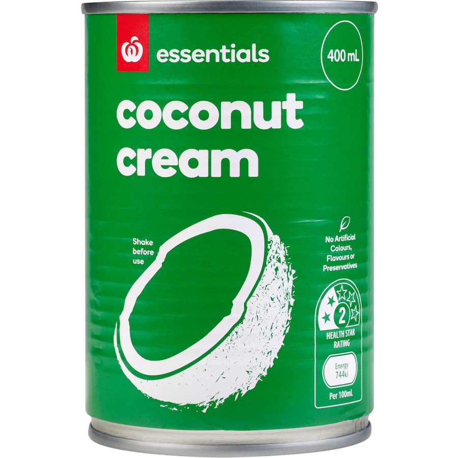 Essentials Coconut Cream in a carton, showcasing its creamy texture, perfect for curries and vegan recipes.