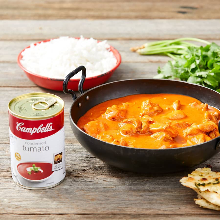Campbell's Tomato Condensed Soup can, rich in flavor, ideal for quick meals, soups, sauces, and casseroles.