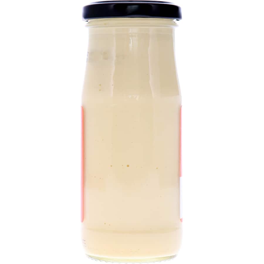 Heinz Salad Cream bottle showcasing its tangy flavor, perfect for salads, sandwiches, and dips, with no preservatives.