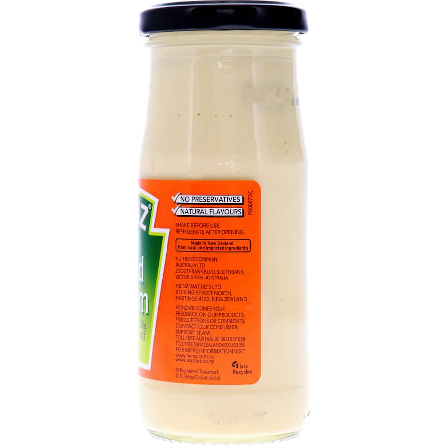 Heinz Salad Cream bottle showcasing its zesty flavor, perfect for salads, sandwiches, and barbecues without preservatives.