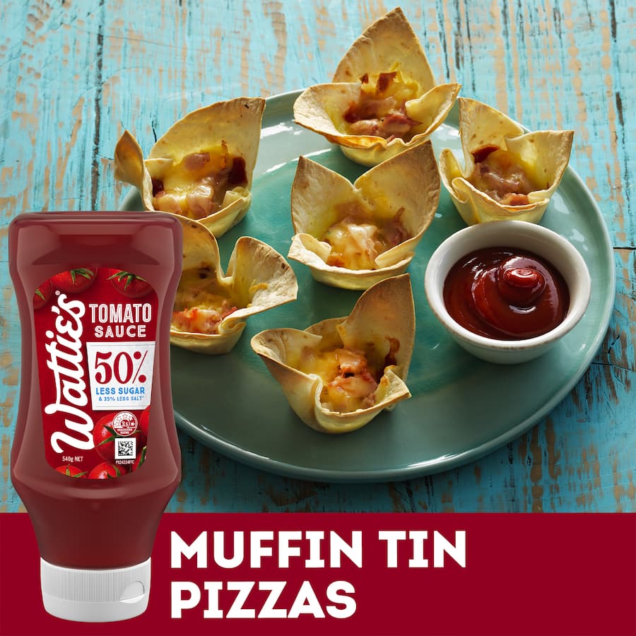 Wattie's 560g Tomato Sauce with 50% less sugar and salt, perfect for healthier meals and summer barbecues.