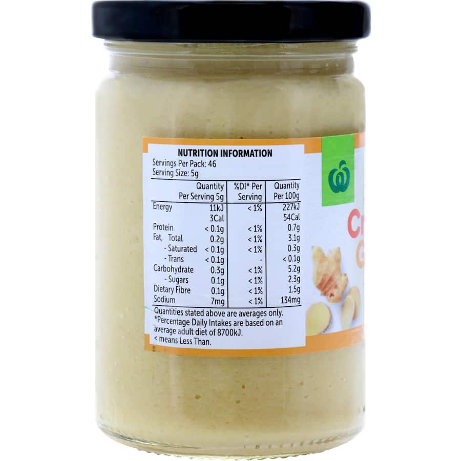 A jar of Woolworths Crushed Ginger, perfect for enhancing stir-fries and curries with authentic flavor.