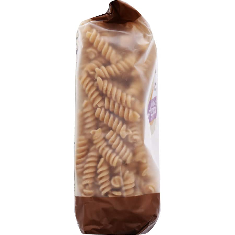 Macro Organic Wholemeal Pasta Spirals in a bowl, showcasing their texture, perfect for nutritious meals and versatile recipes.