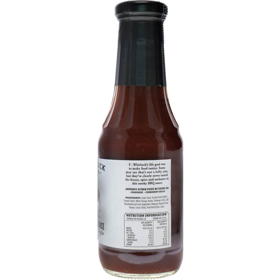 F. Whitlock & Sons Smoky BBQ Sauce bottle showcasing rich flavors of tomato, honey, and spices, perfect for grilling.