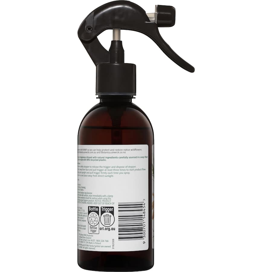 Air Wick Botanica Room Spray featuring Caribbean Vetiver & Sandalwood, a non-aerosol air freshener with natural essential oils.