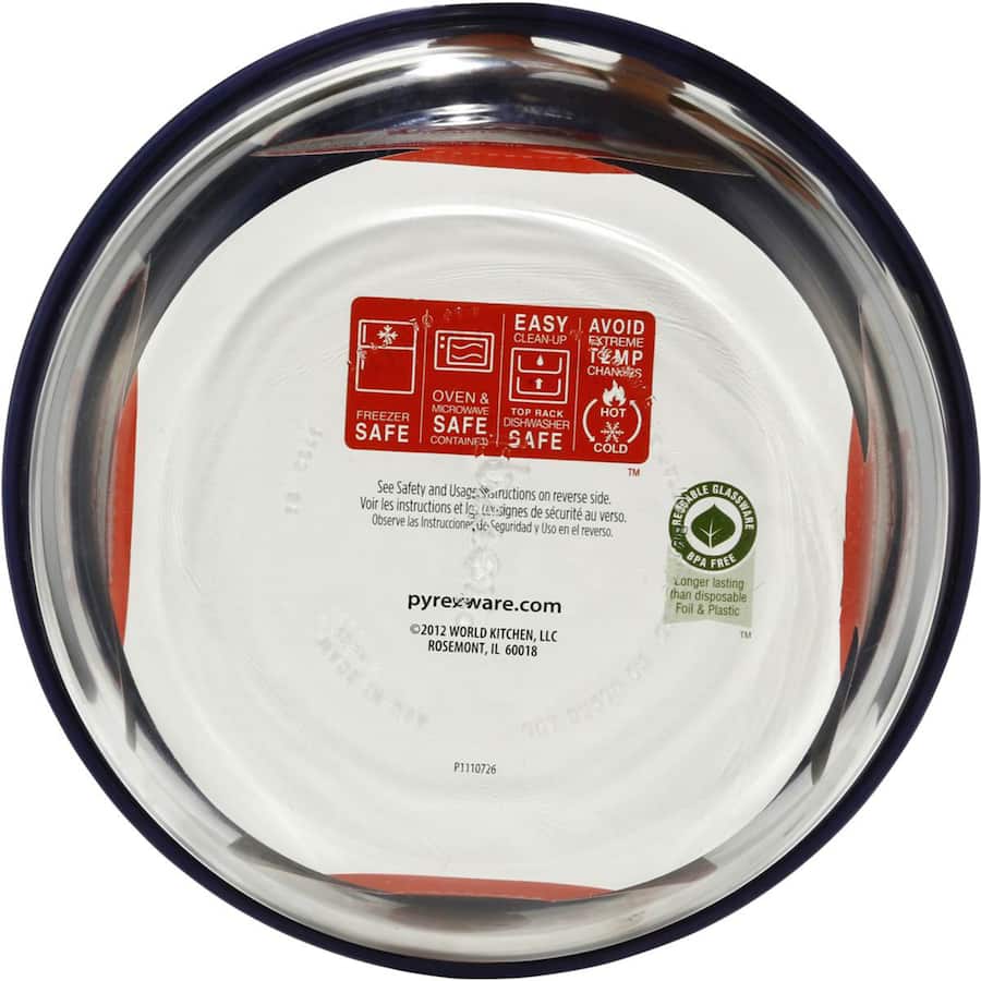 Clear glass Pyrex bowl with a lid, 7-cup capacity, perfect for food storage, microwave, and dishwasher safe.