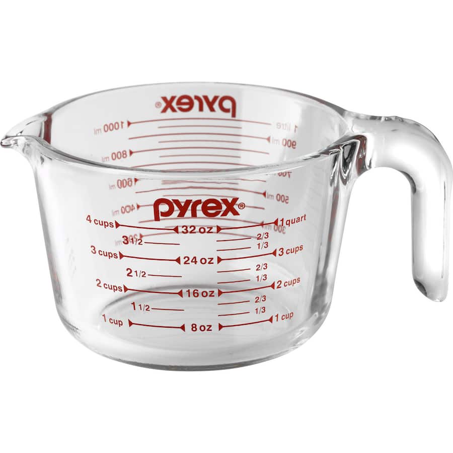 Pyrex Measuring Jug, 4 cups capacity, durable glass, microwave and dishwasher safe, ideal for precise measuring and mixing.