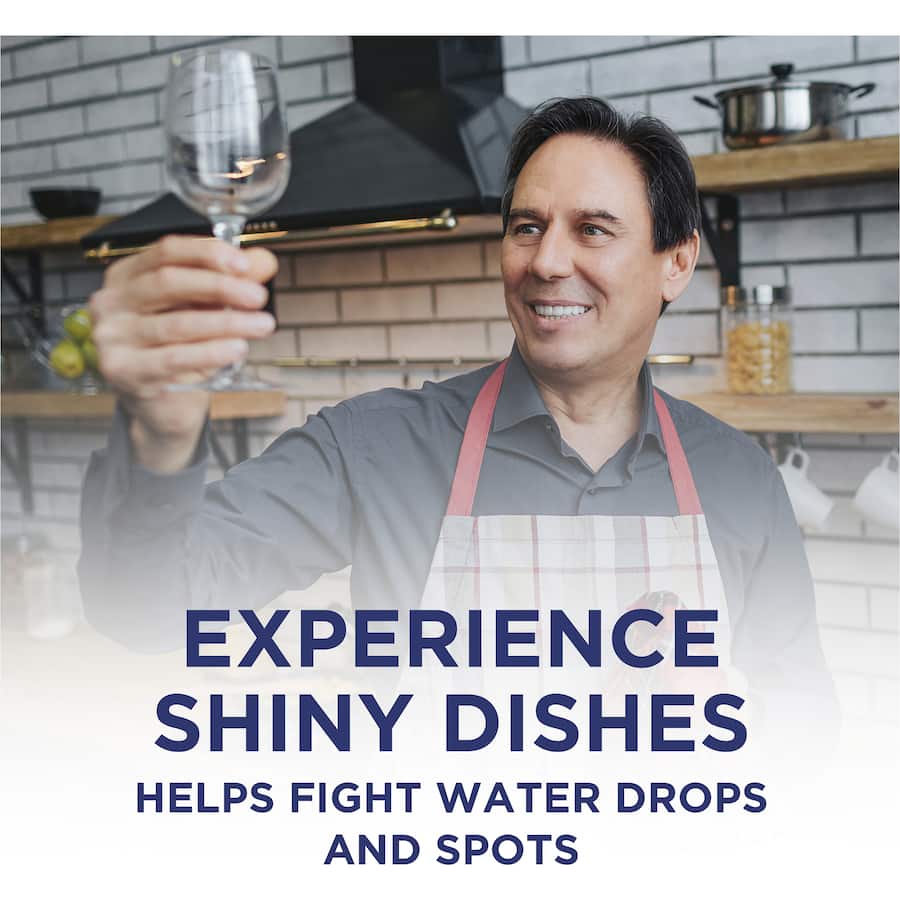 Finish Dishwasher Rinse Aid Regular bottle, promoting drier, shinier dishes while fighting water spots and oily residue.