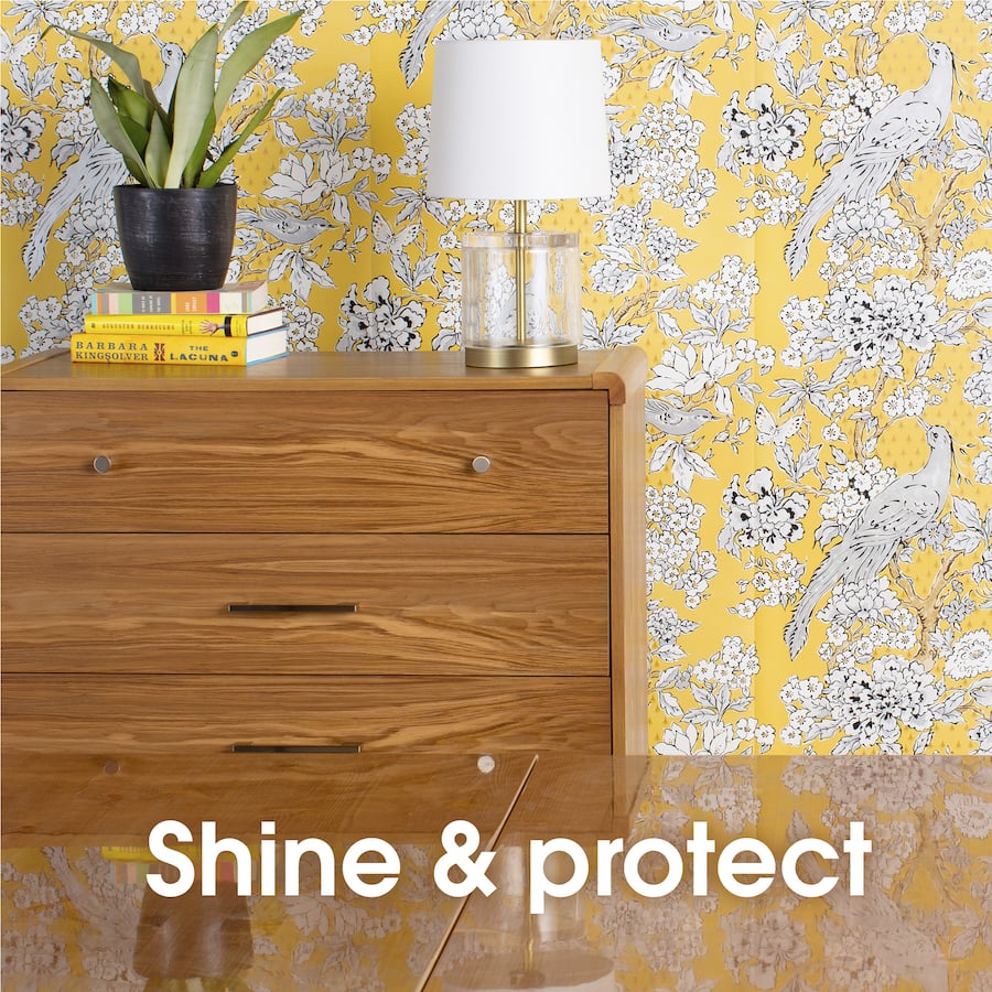 Pledge Furniture Polish Lemon bottle, designed to clean and shine wood and laminate surfaces with a fresh lemon scent.