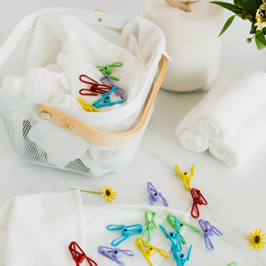 Durable PVC coated steel clothes pegs in vibrant colors, perfect for secure indoor and outdoor laundry use.