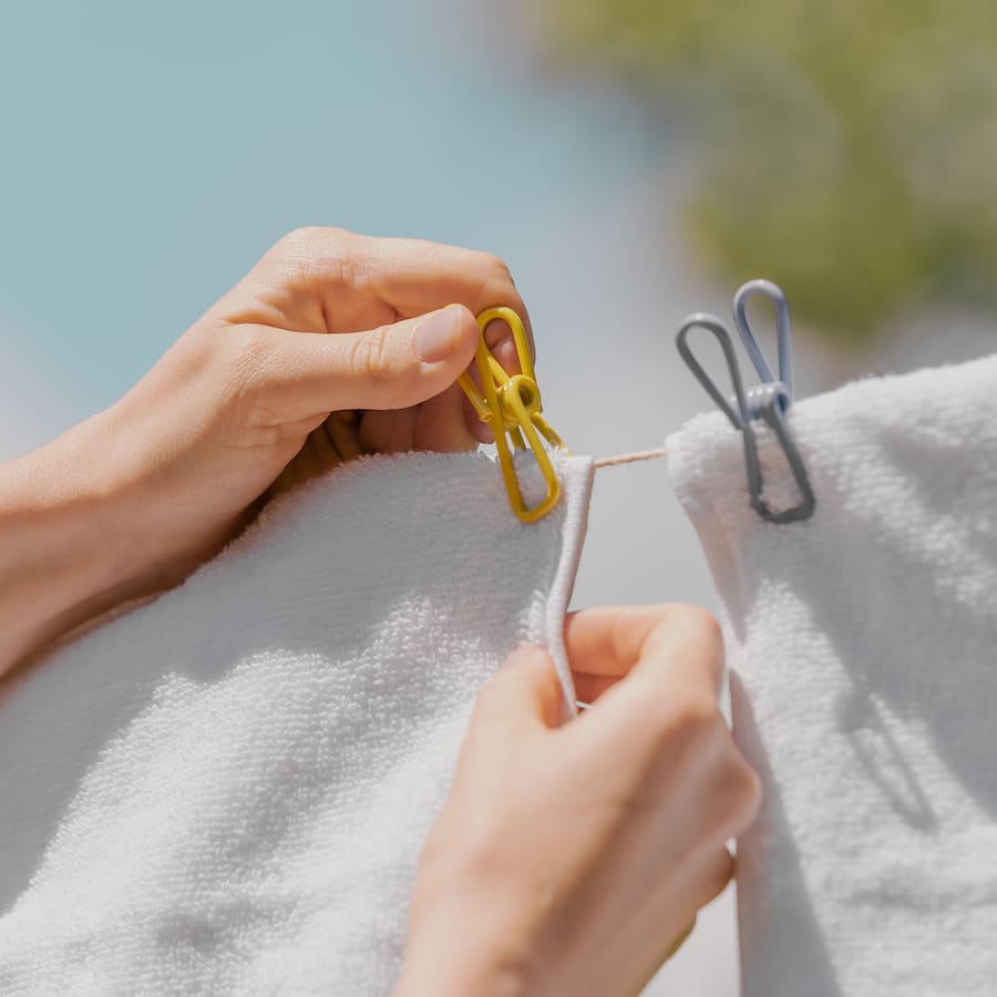 Durable PVC coated steel clothes pegs with rust resistance and ergonomic design, perfect for indoor or outdoor use.