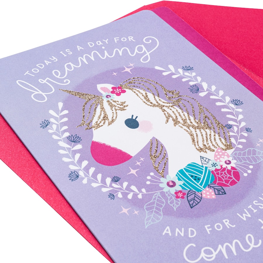 Hallmark birthday card for females featuring a vibrant unicorn design, perfect for celebrating her special day.