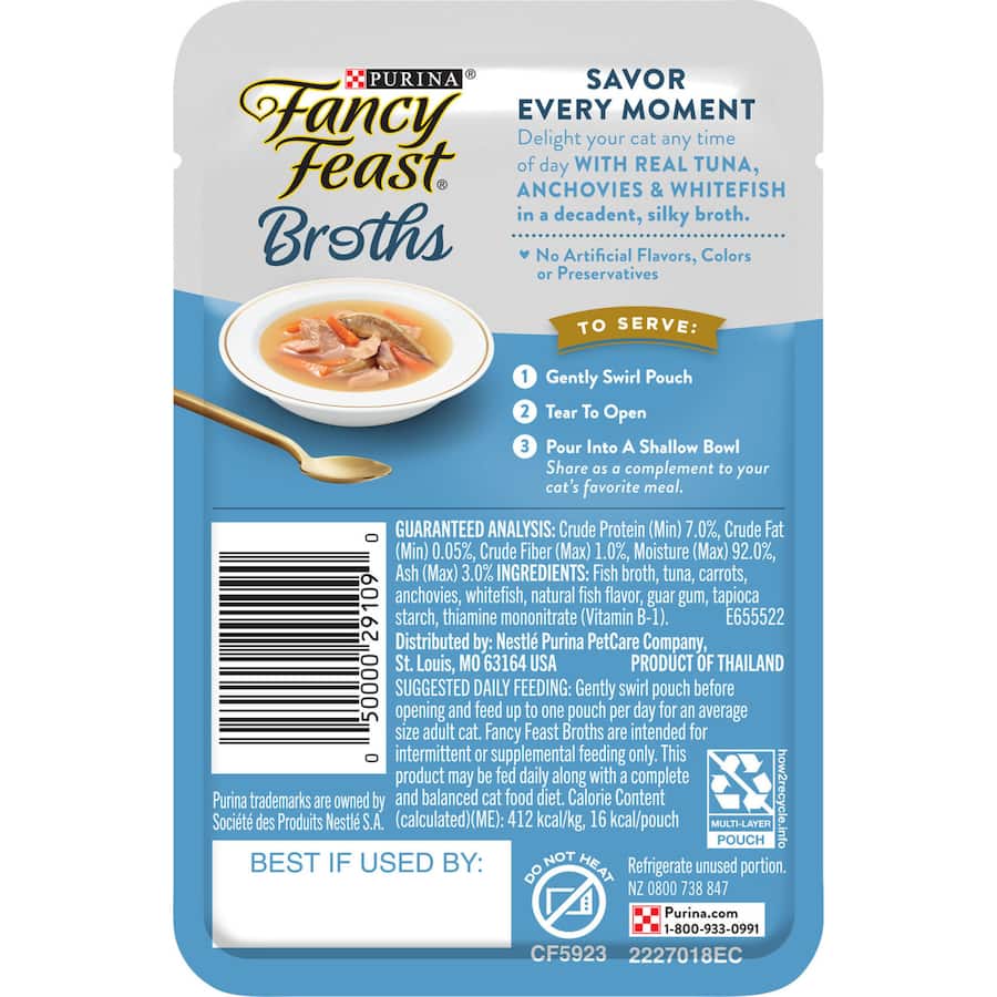 A dish of Fancy Feast Broths featuring tuna, anchovy, and white fish in a silky broth for a gourmet cat treat.