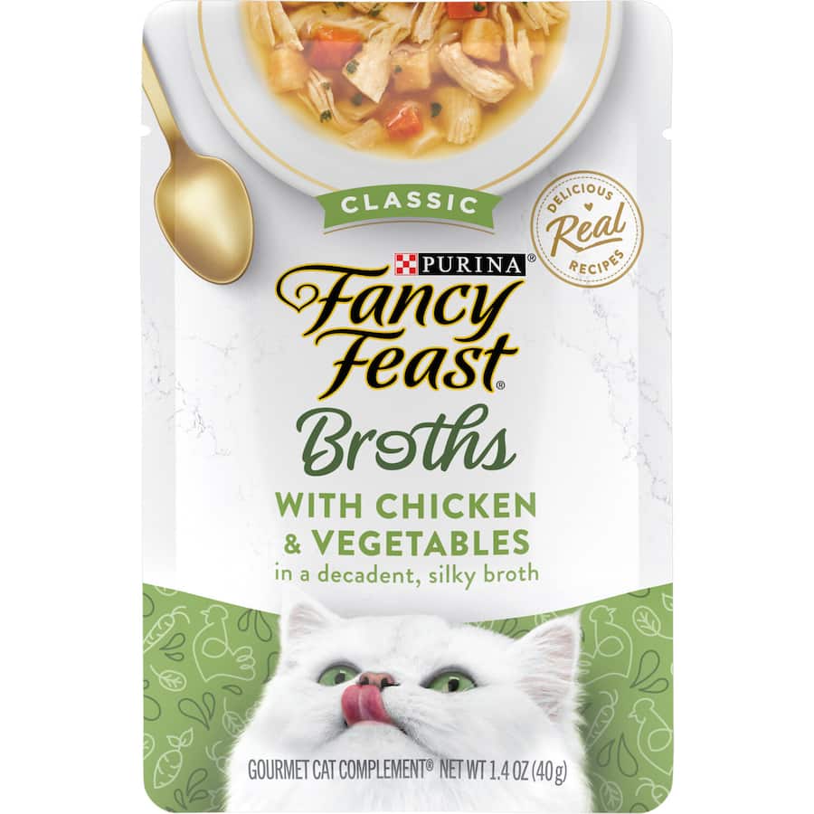 Gourmet wet cat food featuring tender chicken pieces and fresh vegetables in a rich, silky broth.
