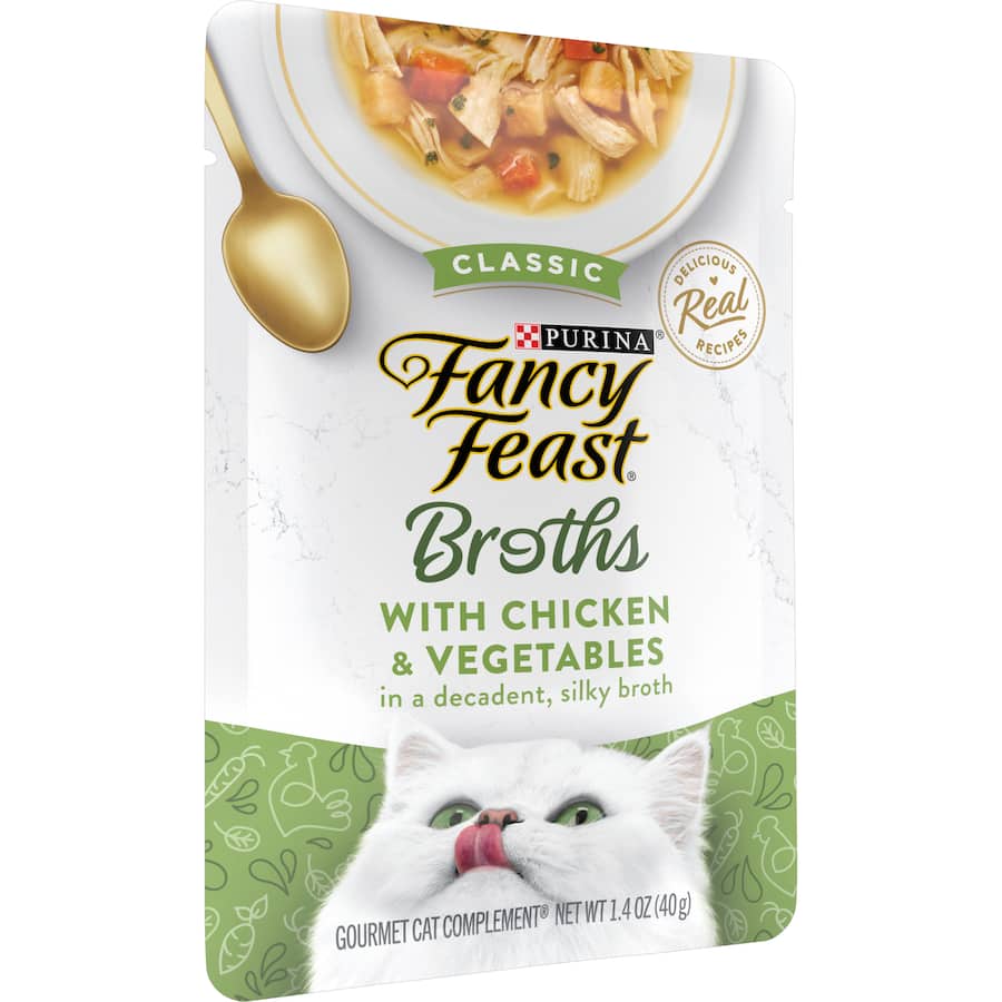 A gourmet wet cat food featuring tender chicken and fresh vegetables in a rich broth, free from artificial additives.
