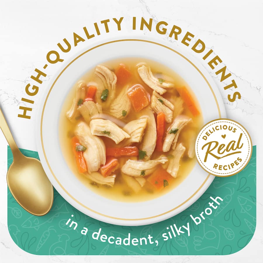 Gourmet cat food featuring chicken, whitefish, and veggies in a silky broth for a luxurious treat.