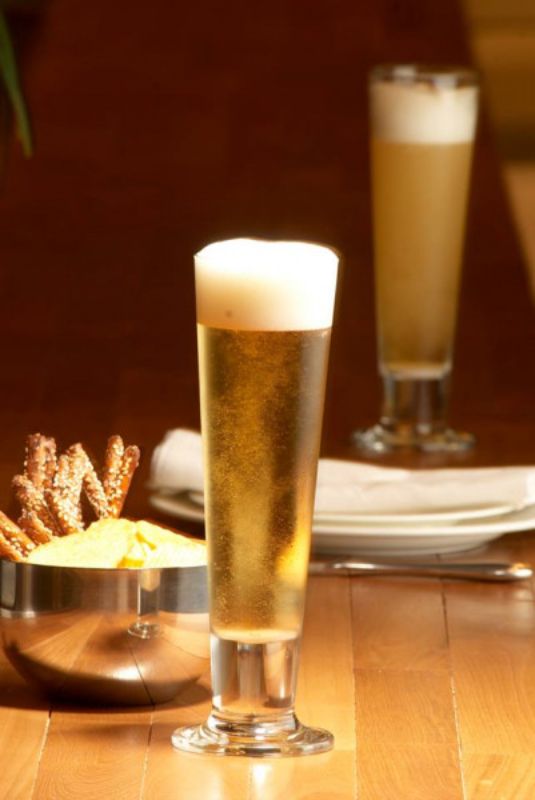 Set of 6 elegant 420ml footed pilsner glasses, ideal for showcasing beers and cocktails with a tall, stylish design.