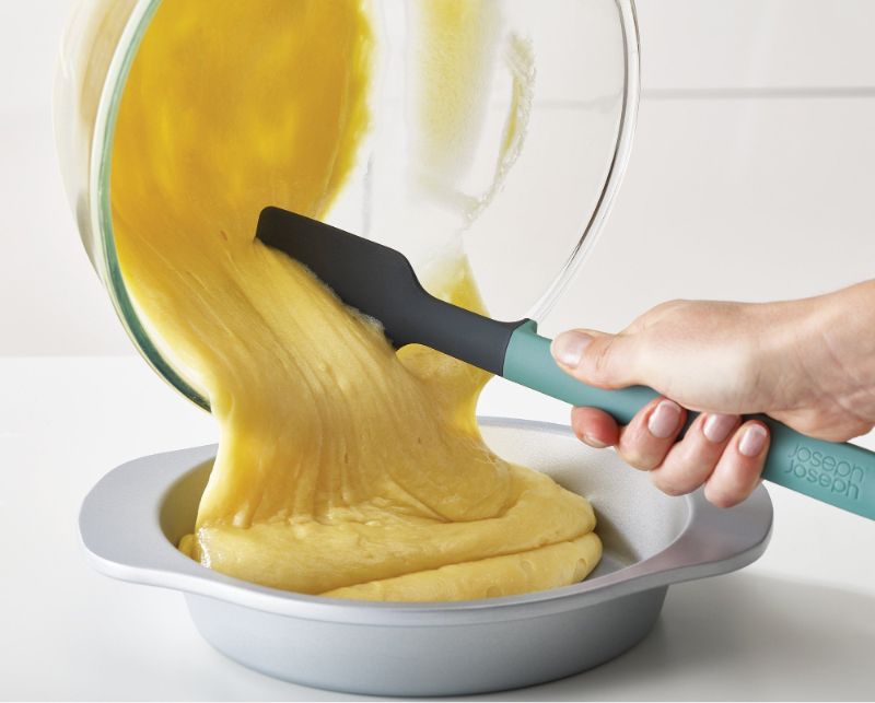 5-piece silicone utensil set with compact storage stand, heat-resistant heads, and integrated tool rests for hygiene.