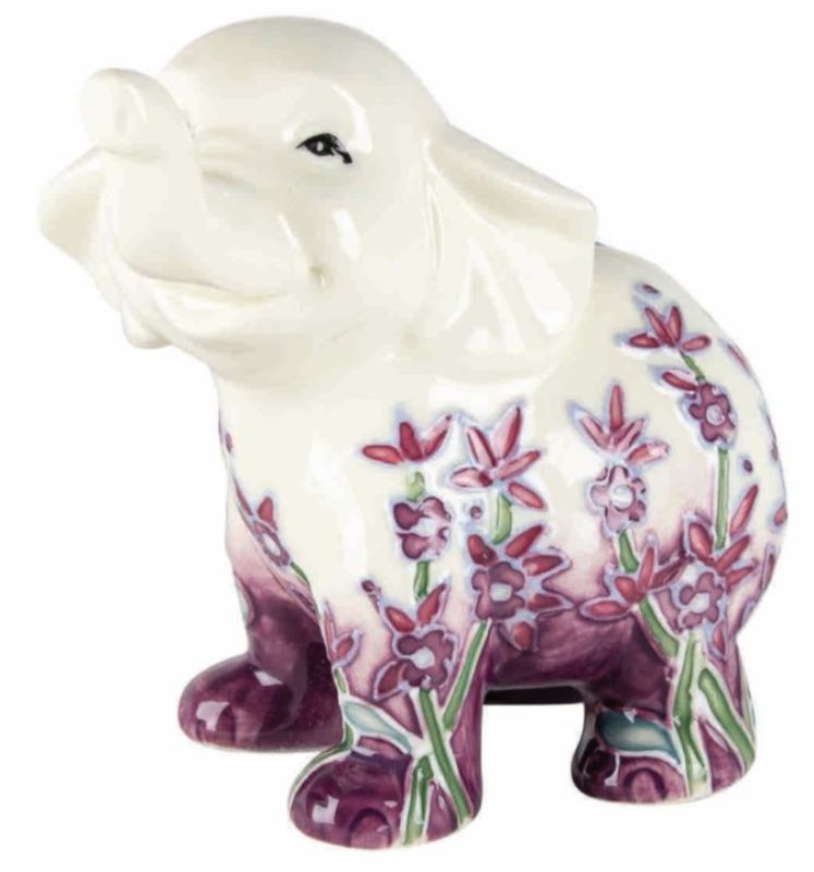 Lavender elephant ornament (10cm) adds charm and positivity to home decor with its intricate design and soothing hue.