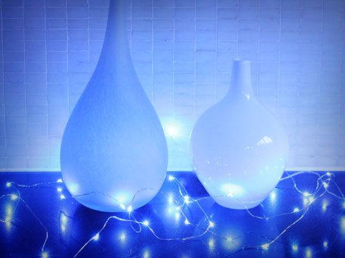 Delicate 10M silver wire fairy lights with 100 blue LEDs, perfect for creating enchanting indoor atmospheres.