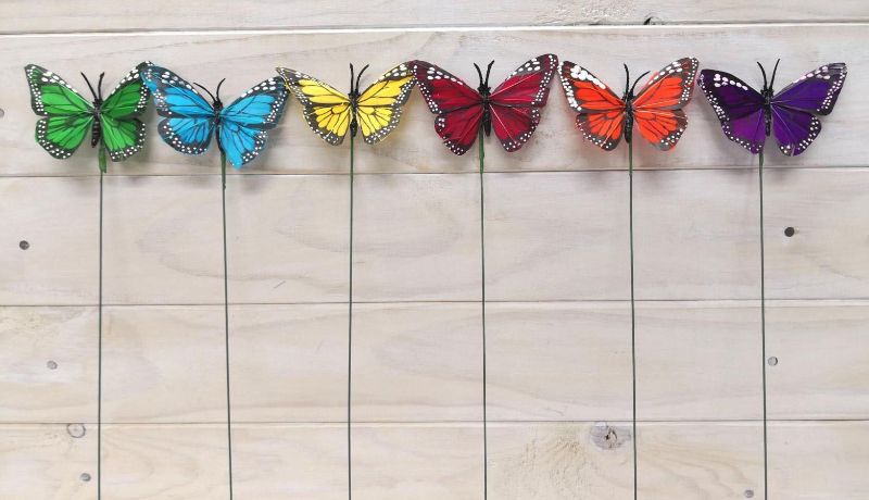 Vibrant 3.75" butterfly picks with intricate details, perfect for enhancing floral arrangements and crafts (pack of 12).