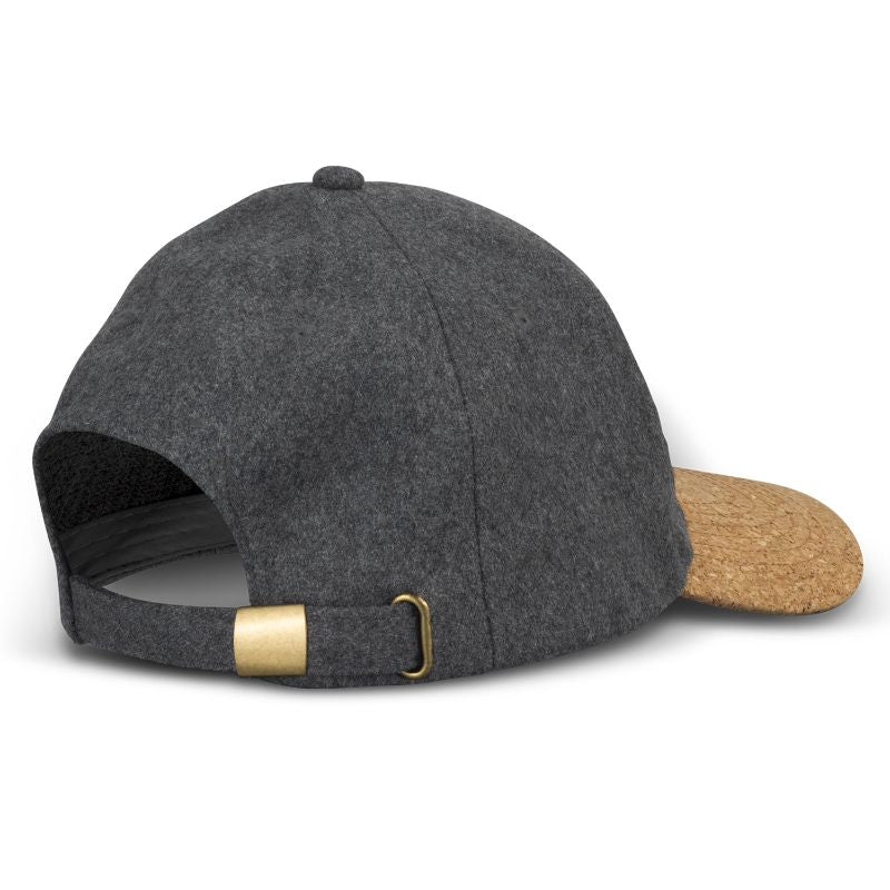 Charcoal six-panel cap featuring a curved cork peak, grey eyelets for breathability, and an adjustable brass buckle.
