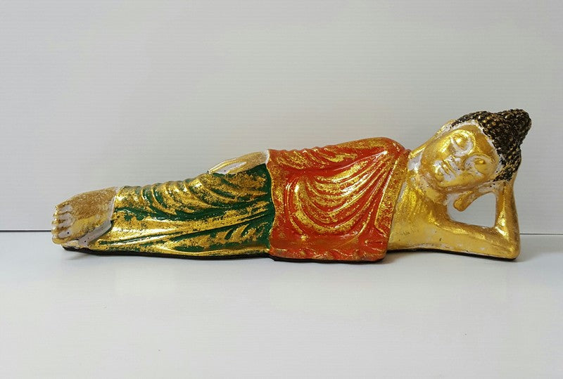 Orange Lying Buddha statue, 30x8x9cm, embodies tranquility and mindfulness for serene home decor.