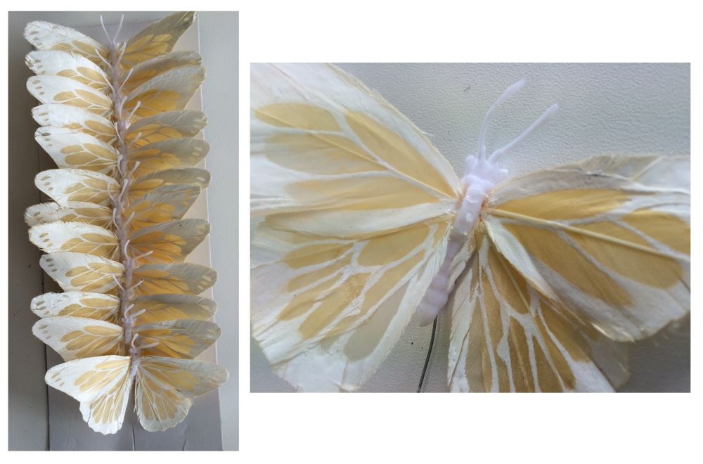 Vibrant set of 12 artificial butterflies with flexible wire bodies, crafted from soft feathers for versatile decor and crafting.
