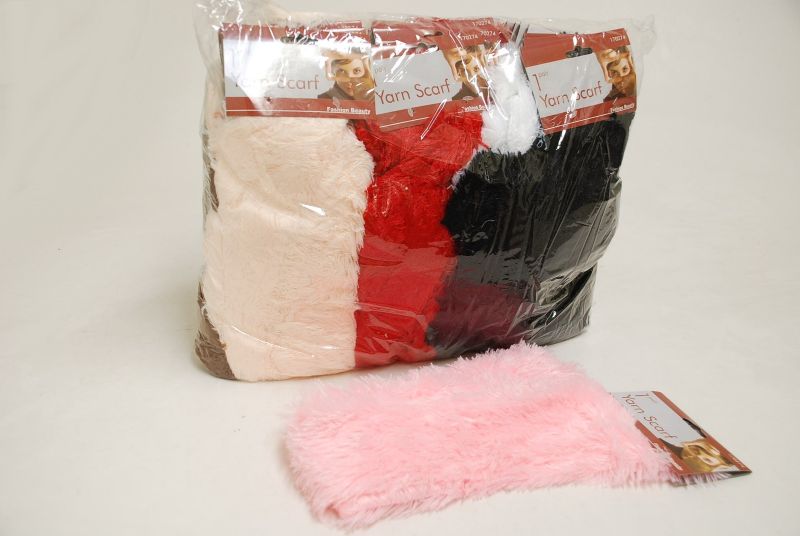 Assorted yarn scarves showcasing vibrant colors, ideal for winter fashion and versatile styling options.