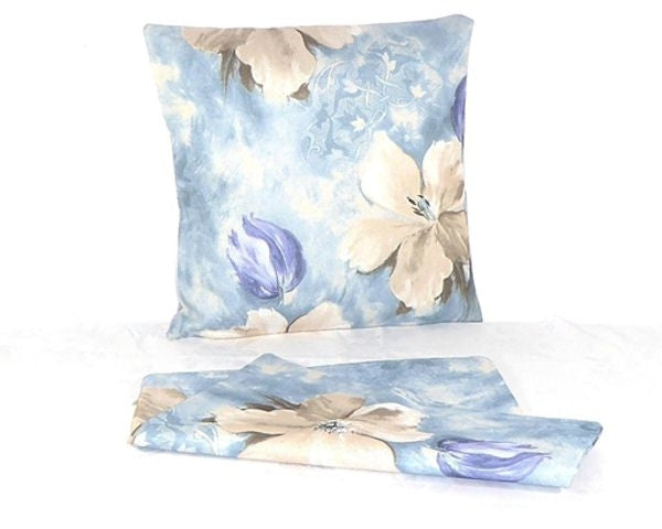 Vibrant indigo watercolor cushion covers set, featuring durable linen fabric and prints on both sides. Perfect for home decor.
