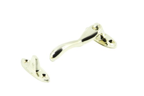 Polished brass wedge fastener for casement windows, featuring secure closing mechanism and rust-resistant solid brass construction.