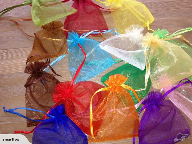 Vibrant orange organza bags with satin drawstring, perfect for gifts and favors, pack of 50 at clearance price.