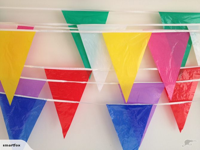Vibrant pink bunting flags on a 10m strand, perfect for any celebration, durable and weather-resistant for indoor/outdoor use.