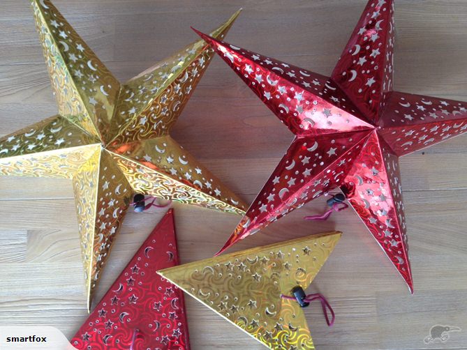 Three red star lanterns, 45cm, beautifully crafted to create enchanting patterns when illuminated; perfect for decor and celebrations.