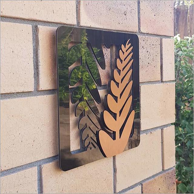 Elegant 2-tone fern art panels in brushed copper and black, perfect for indoor or outdoor Kiwiana-inspired decor.