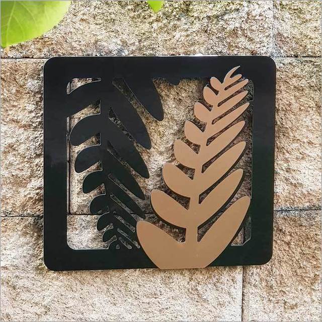 Two-tone fern art panels in brushed copper and black, perfect for indoor/outdoor decor, measuring 275mm x 300mmH.