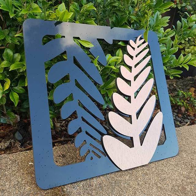 Eye-catching two-tone fern art panels in brushed copper and black, perfect for indoor or outdoor Kiwiana decor.
